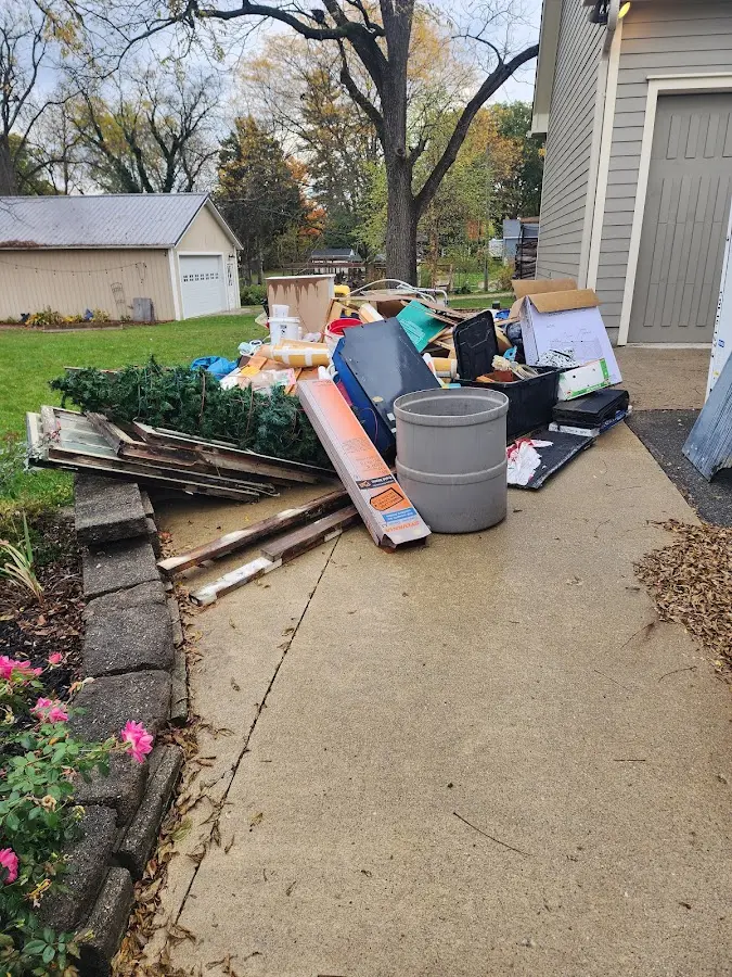 Dumpster being loaded with debris for 3 Yard Dumpster Rental in Little Chute